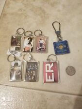 Lot of 7 vintage to now keychains music stars and other picture