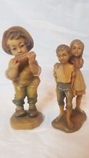 Two Carved Wooden Figurines, Hansel and Gretel and Boy with Harmonica  picture