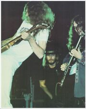 Lynyrd Skynyrd 1970's era playing guitars in concert 8x10 inch photo picture