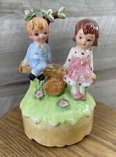 Lefton Vintage Music Box Boy And Girl Sitting On A Log, Outdoors picture