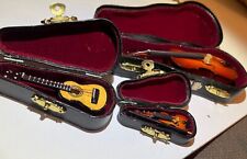 3 Mini Guitar & Violins  In Case, 2&1/2”, 3&1/2” And Just Under 6”. Pristine con picture