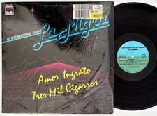 GRUPO LA MIGRA Amor Ingrato, Tres Mil Cigarros 1985 LP, Nice in Shrink, VG+/VG+ picture