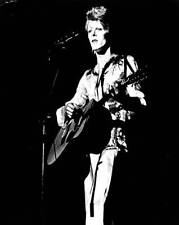 David Bowie plays acoustic guitar as he performs onstage in his Zi- Old Photo picture