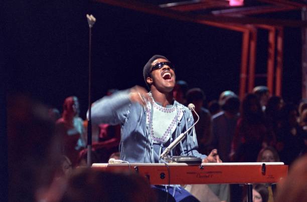 Stevie Wonder playing a Hohner Clavinet keyboard performs on the s- Old Photo