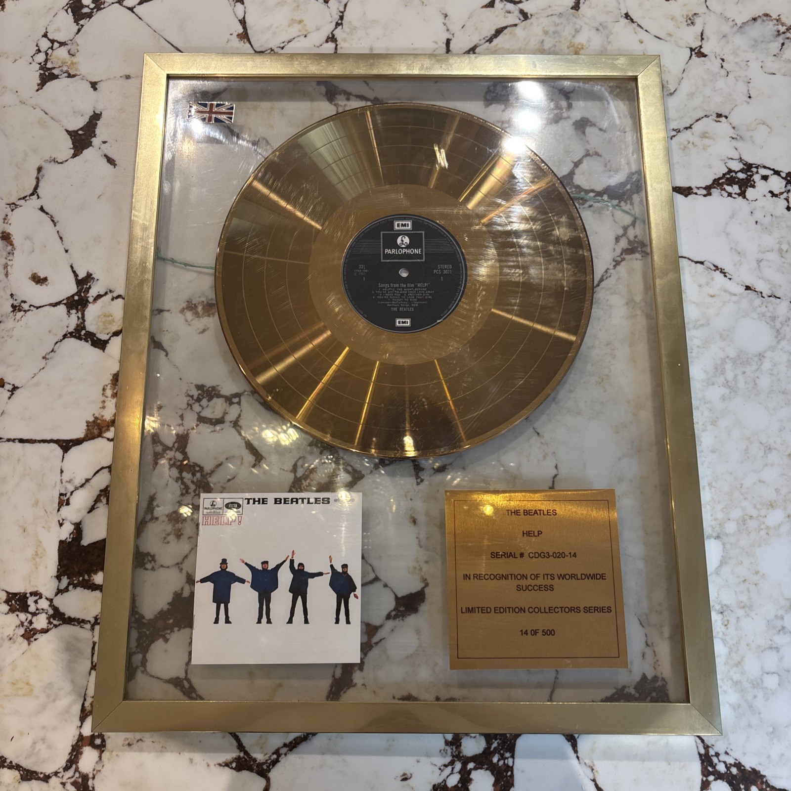 The Beatles help Framed Gold Disc