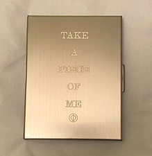 Rosalía Rosalia LUX Cigarette Case Engraved Reliquia TAKE A PIECE OF ME lyrics  picture