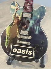 Oasis miniature Guitar - 10 inches tall - includes stand - UK stock picture